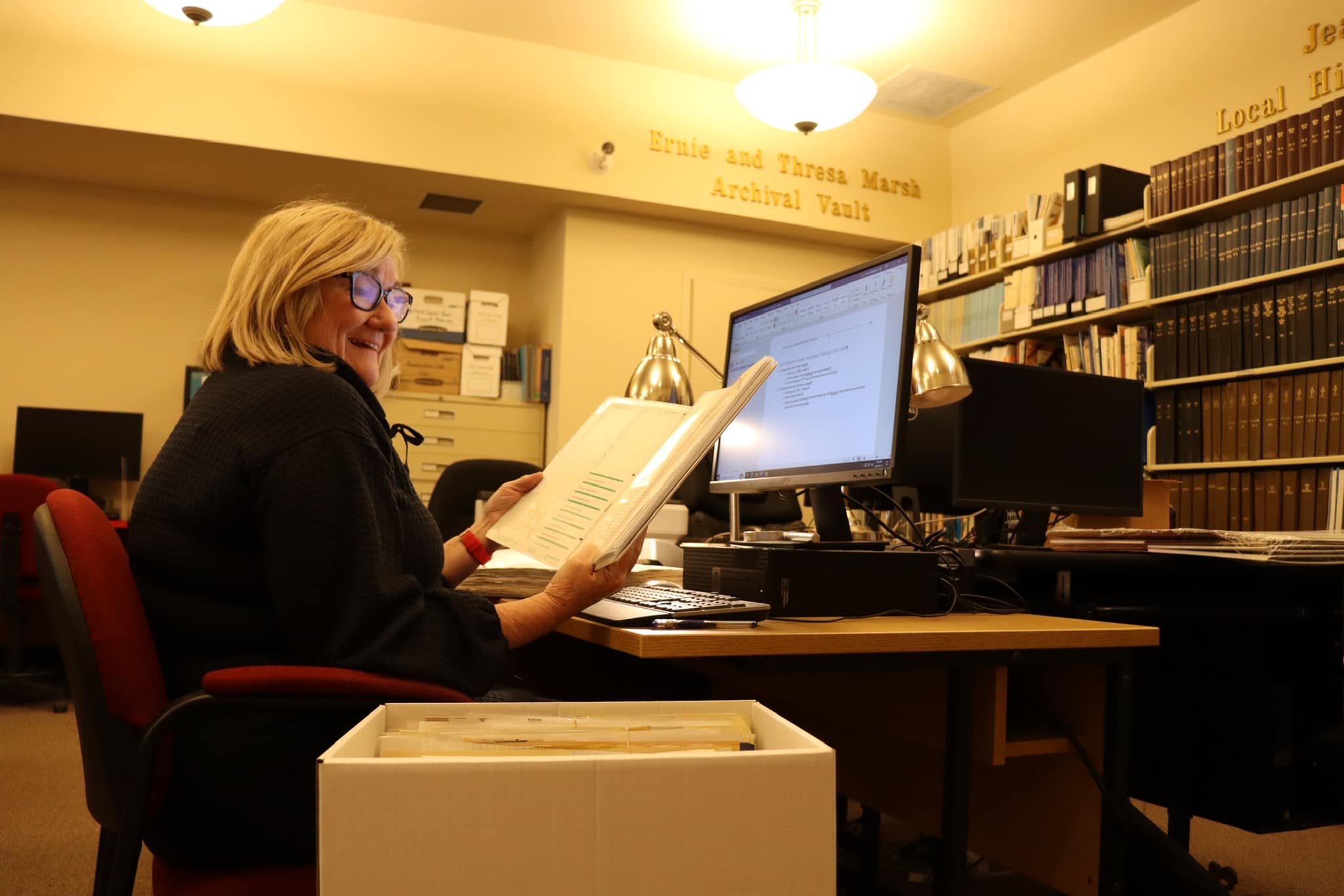 Volunteer research working at the L.R. Wilson Archives 